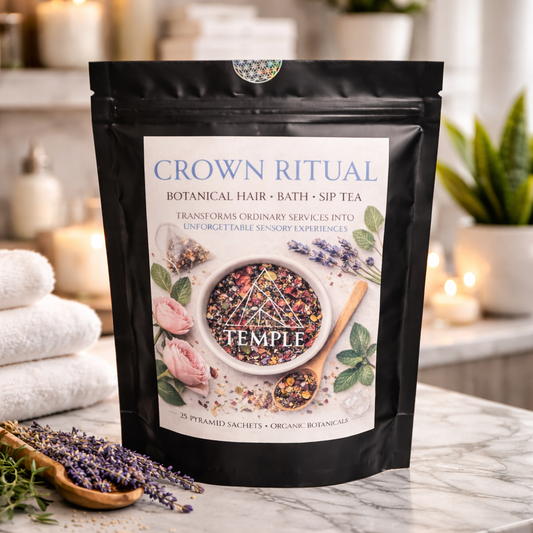 Crown Ritual botanical product packaging on a marble surface with lavender and towels in the background