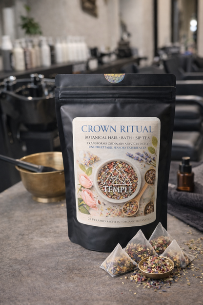 Packaged botanical hair, bath, and spa tea from Temple on a counter with a blurred salon background.